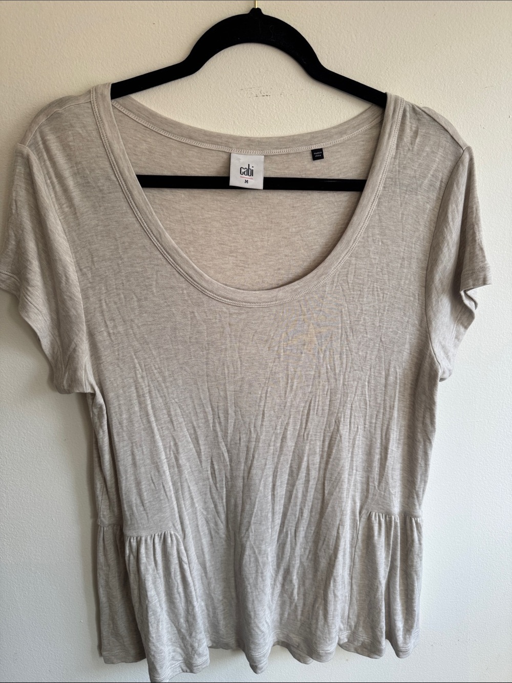 CAbi Scoop Neck Peplum Tee in Light Beige